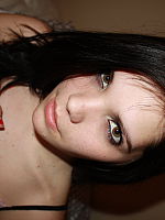 Photo 1, Her dark hair is
