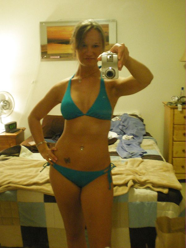 Sexy amateur teen in bikini enjoys selfshooting herself pic image